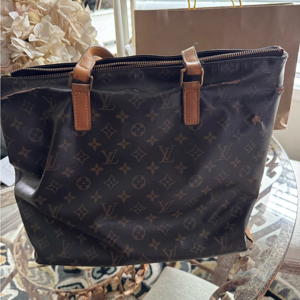 A very well loved Louis Vuitton Monogram Tote